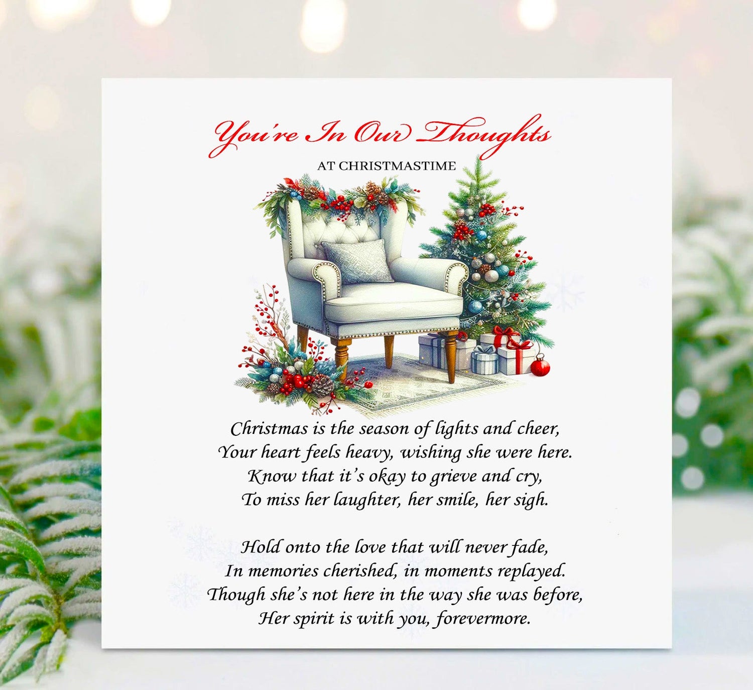 Christmas remembrance greeting card featuring a cosy armchair decorated with festive garlands beside a Christmas tree, titled "You're In Our Thoughts at Christmastime", with a heartfelt memorial poem for someone missing a loved one at Christmas.