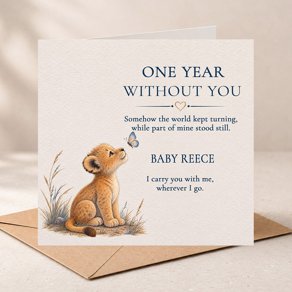 A square sympathy card with a kraft envelope, featuring an illustration of a lion cub looking up at a butterfly with the text 'ONE YEAR WITHOUT YOU' and a personalized message for 'BABY REECE'.